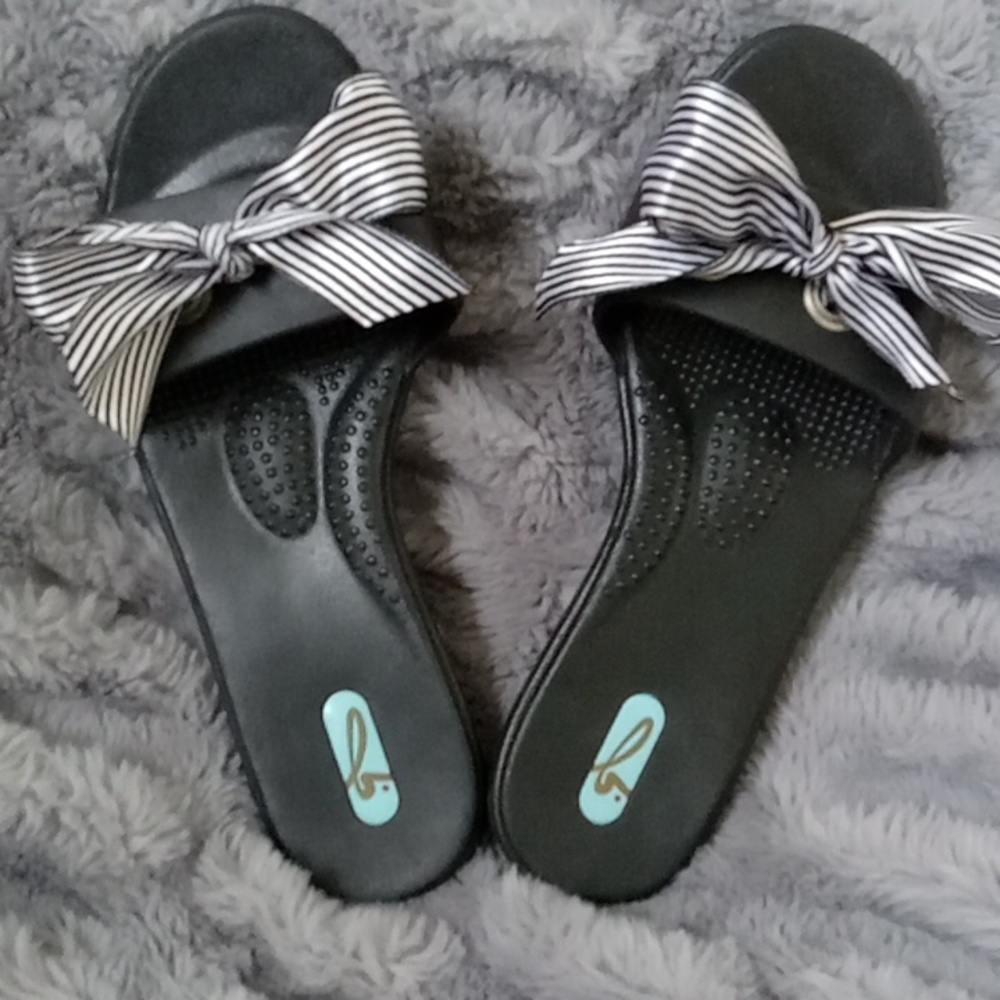 Black OKA b slip on sandals with black and white striped ribbon. Never worn. But
